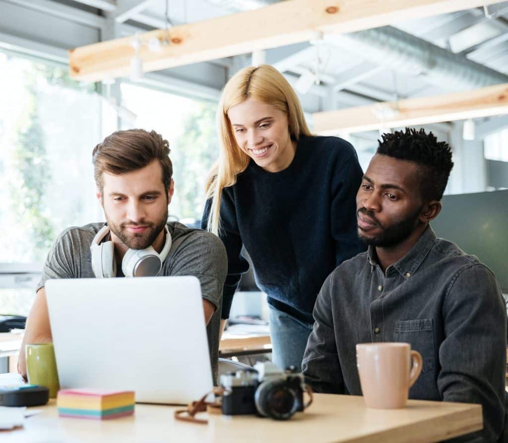 happy-colleagues-sitting-in-office-coworking